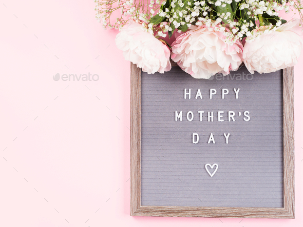 Happy mothers day greetings on letter board on pink background Stock Photo  by tenkende