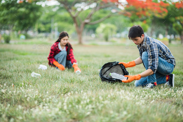 TeamWork Collect Garbage In The Park Stock Photo, Picture And