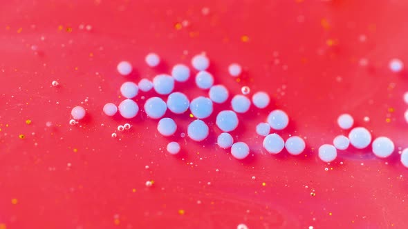 Bright Collors Bubbles Slow Motion Oil Ink. Pink and blue Bubblegum flavor background. alt