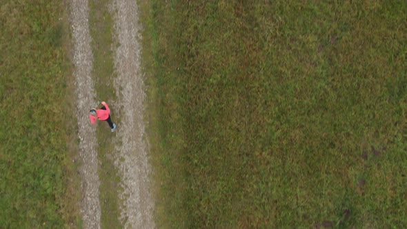 Aerial View Following Jogging Woman