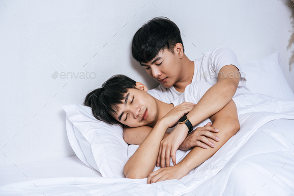 Two beloved young men slept in bed together.