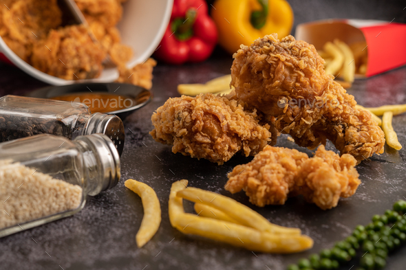 Download Fried Chicken And French Fries On Black Cement Floor Stock Photo By Johnstocker