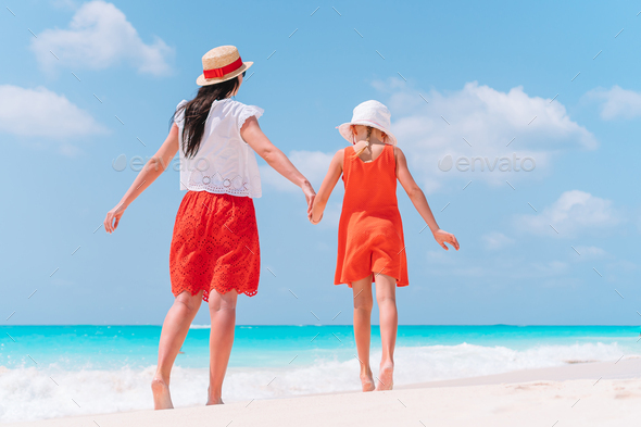 Beautiful Mother And Daughter At Caribbean Beach Enjoying Summer 