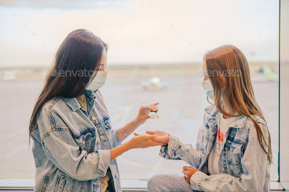Little kid in medical mask in airport waiting for boarding - Stock Photo - Images