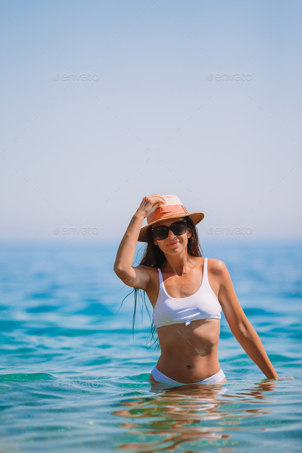 Teen girl in bikini against Blue sky, Stock Photo, Picture And