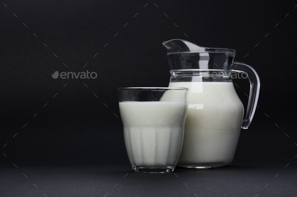 Jar and glass of milk isolated on black background with copy space for  text, dairy product concept Stock Photo by xamtiw