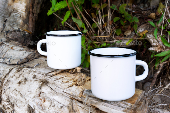 Download Placeit Two White Campfire Enamel Mug Mockup With Tree Stump Stock Photo By Tasipas