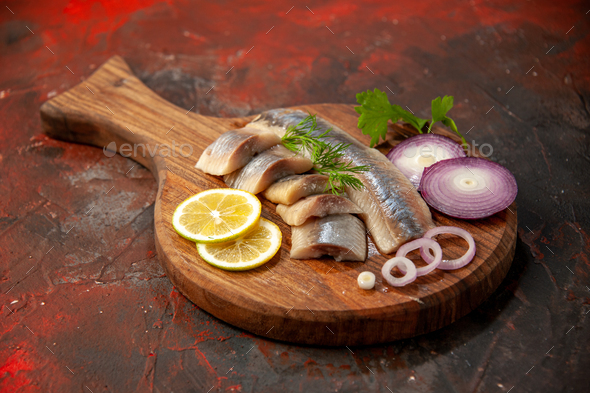 front view fresh sliced fish with onion rings and lemon on dark background meal meat seafood snack