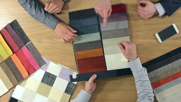 Decorator showing fabric swatches