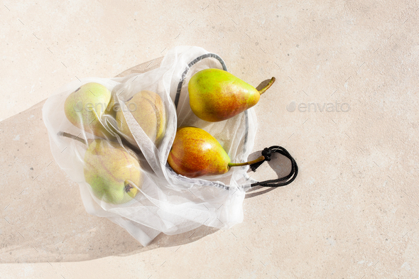pears fruits in reusable mesh nylon bag, plastic free zero waste concept