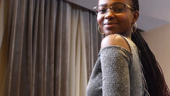 Portrait of Beautiful African Girl in Glasses. alt