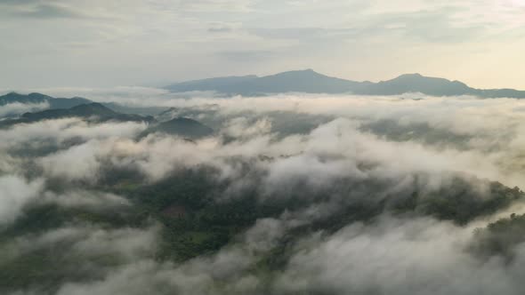 Landscape in the morning time during sunrise with fog above the mountain, alt