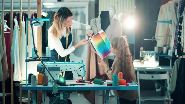 A Girl is Helping Her Mother in the Tailor House alt