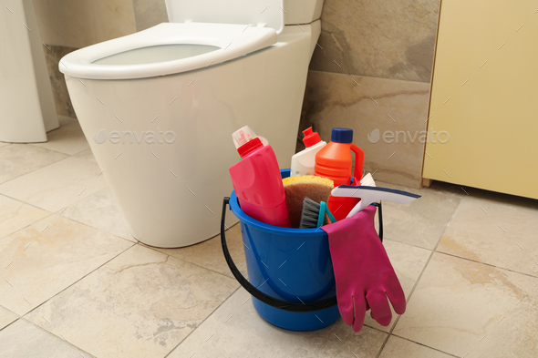 Cleaning Supplies Near Toilet Bowl in Bathroom Stock Image - Image