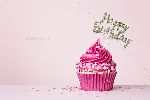 Birthday cupcake with happy birthday banner - Stock Photo - Images
