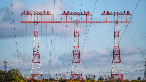 huge high voltage post.High voltage tower under river. power line tower alt
