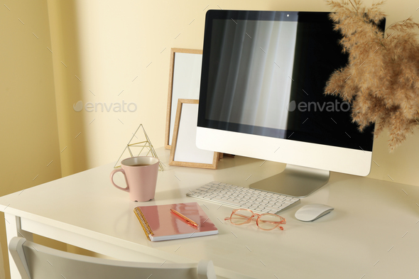 Concept of workplace with modern desktop computer on white table