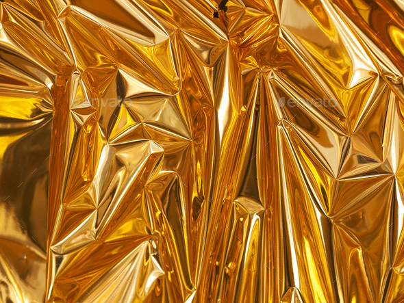 Texture of crumpled foil Gold color.