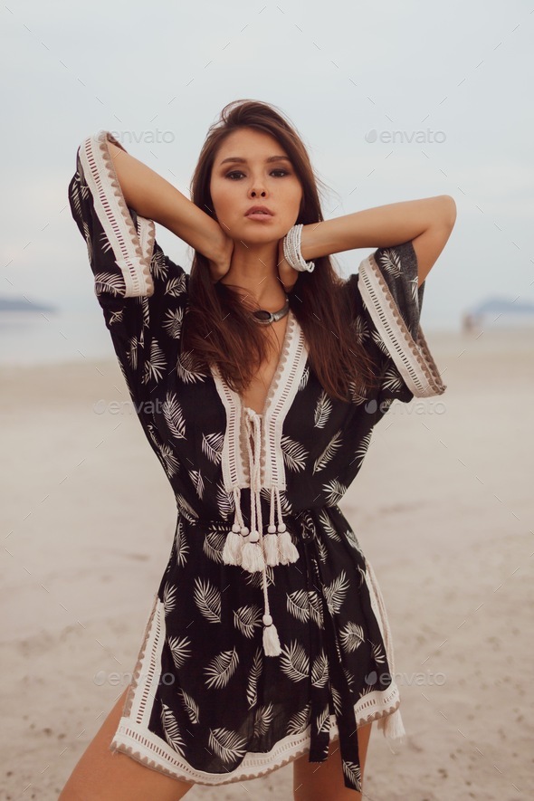 Beautiful Asian Woman In Tropical Bohemian Dress Posing On The Beach Stock  Photo By Ssvetasokolova