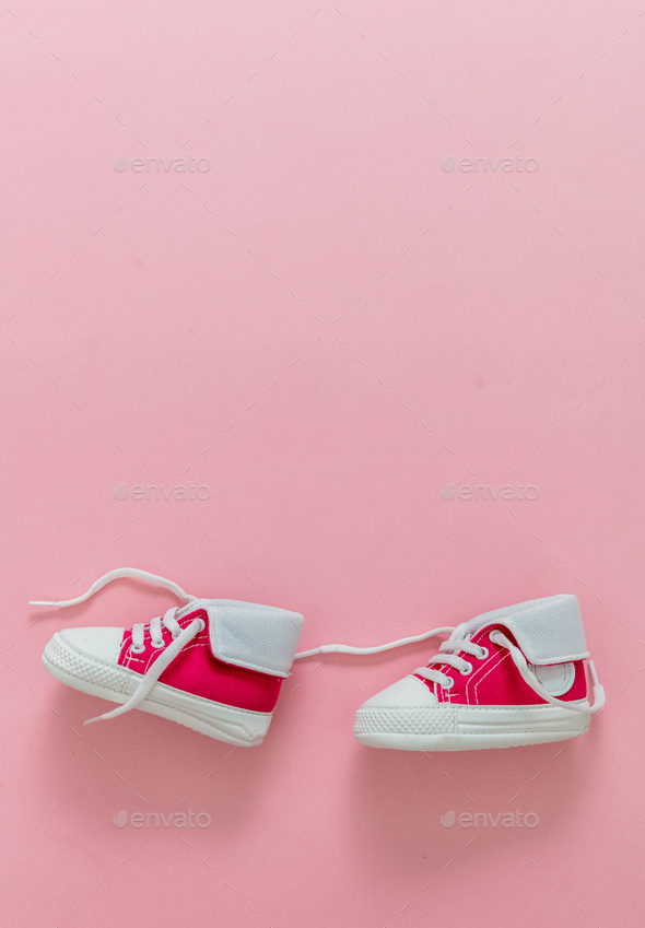 Baby girl shoes on pastel pink color background, copy space Stock Photo by  rawf8