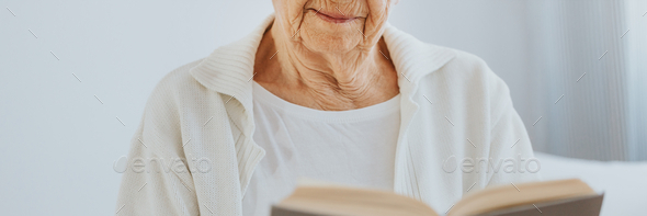 Senior woman reading book in nursing home