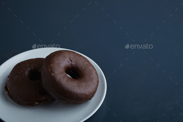 Two donuts isolated on corner table - Stock Photo - Images