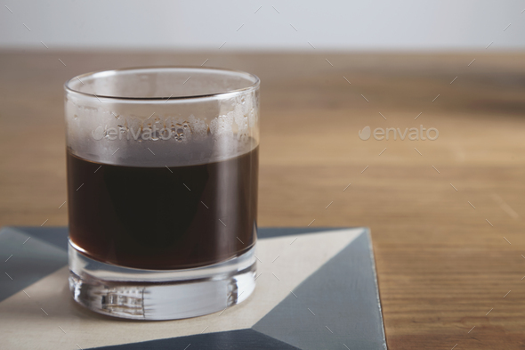 Transparent glass with aero press coffee isolated