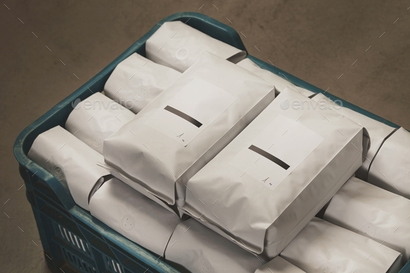 White packages filled with coffee or tea