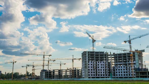 Time Lapse Footage of a Big Construction Site with Several Working Cranes alt