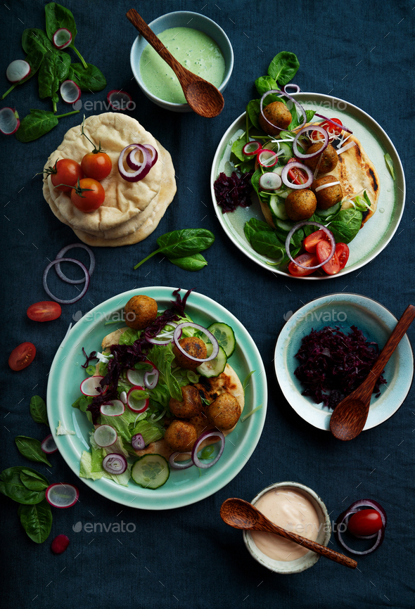 Home made vegan falafel served with various mezze and pita bread