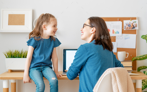 mother with child working on the computer
