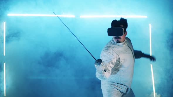 A Man in VRglasses is Training His Fencing Skills alt