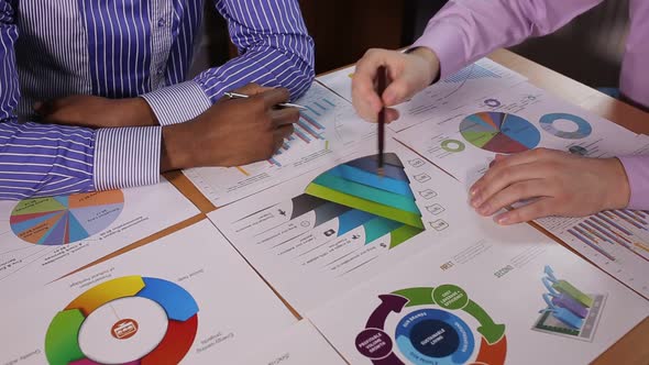 Businessmen discuss infographics alt