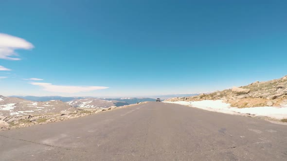 POV point of view -  Driving on alpine road of Mount Evans in Early Summer. alt