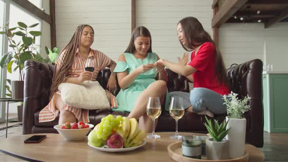 Support and Jealousy Between Three Mixed Race Female Friends Indoors alt