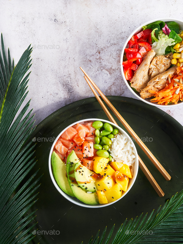 Hawaiian trendy poke bowls salmon, heura soy protein or vegan chicken, variety vegetables.