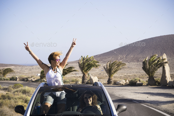 Couple Standing Outside Their Car in Embrace Stock Photo - Image of male,  female: 26312686