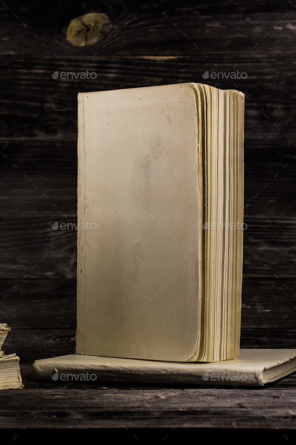 old book on wooden background. - Stock Photo - Images