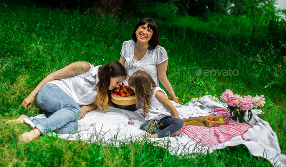 grandmother, daughter and granddaughter on a picnic