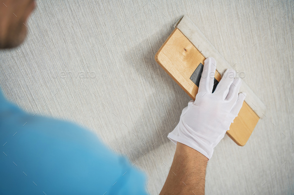 Soft Wooden Vinyl Squeegee Using For Wallpaper Application Stock Photo