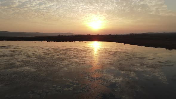 The reflection of the clouds on the river was taken with a drone