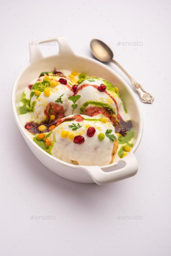 Dahi vada is Indian snack food. Garnished with coriander, boondi