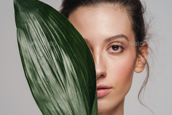 Beautiful Half Naked Woman Posing With Green Leaf On Camera Stock Photo