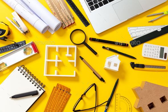 Project blueprints, architect equipment and laptop on yellow color  background, top view Stock Photo by rawf8