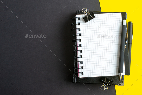 Premium Photo  Notebook with black sheets and white spiral binder and black  pen on a dark background, top view, copy space. business or education  minimal concept