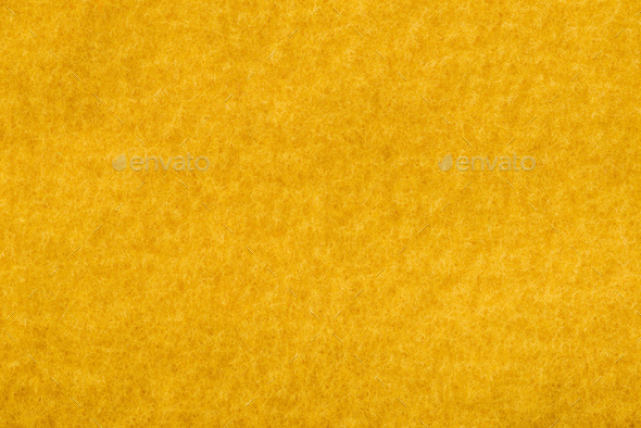 close up view of orange felt texture Stock Photo by LightFieldStudios