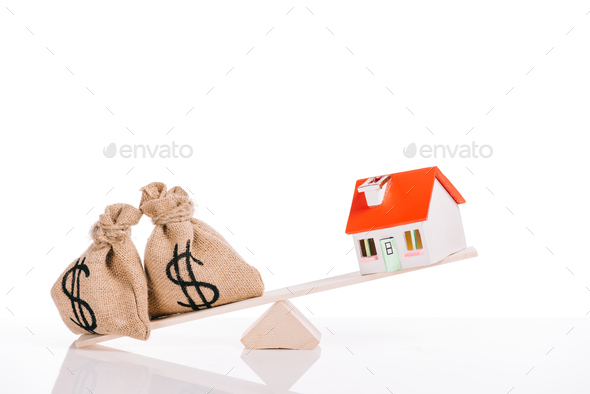 scales with moneybags and house model isolated on white, mortgage concept - Stock Photo - Images