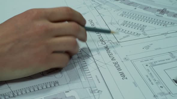 Engineers Planning Road Construction Around Buildings