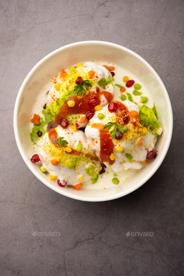 Dahi vada is Indian snack food. Garnished with coriander, boondi