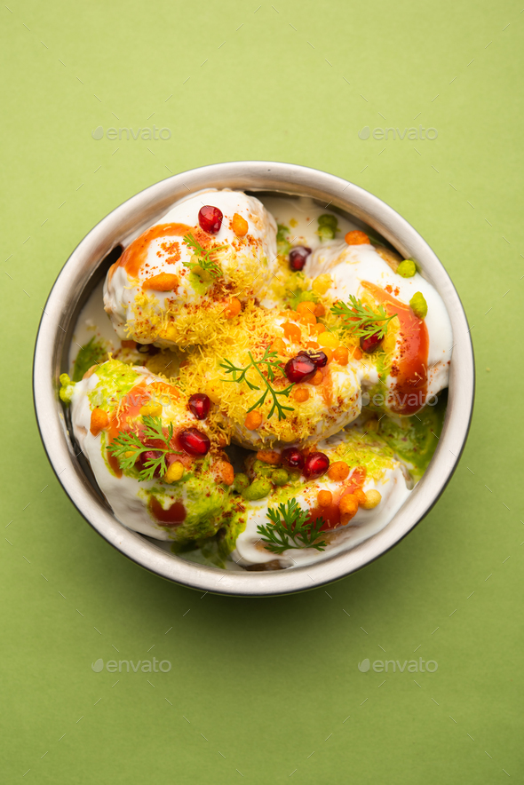 Dahi vada is Indian snack food. Garnished with coriander, boondi